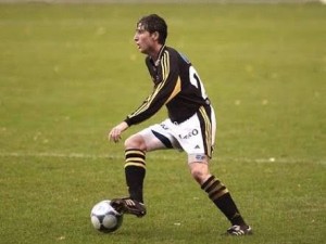 Luke Casserly looking for an option to pass while playing for AIK Stockholm in the 2000 season of the Swedish First Division